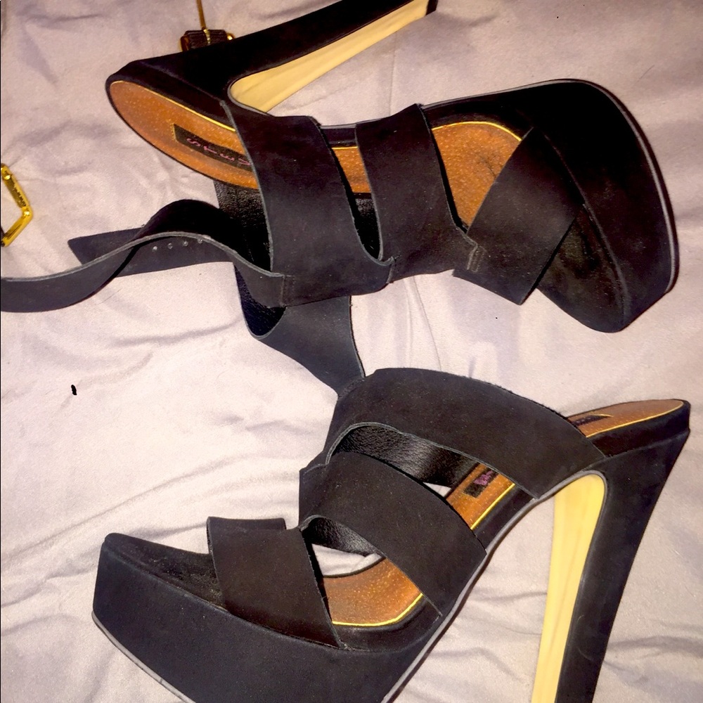 Steve Madden black strappy platform heels.